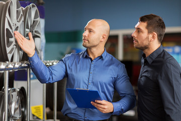 Wall Mural - customer and salesman at car service or auto store