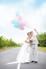 Wall Mural - Happy beautiful couple on wedding day, outdoors