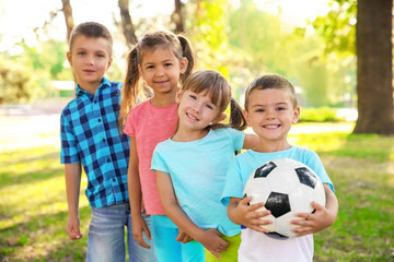 Poster - Cute little children with ball in park