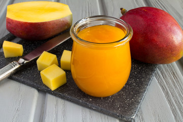 Wall Mural - Puree with mango and ingredient on the grey cutting board