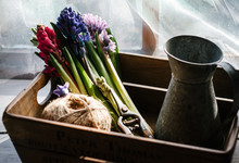 Hyacinth Flowers, A Jug And Twine In A Reclaimed Wooden Box.