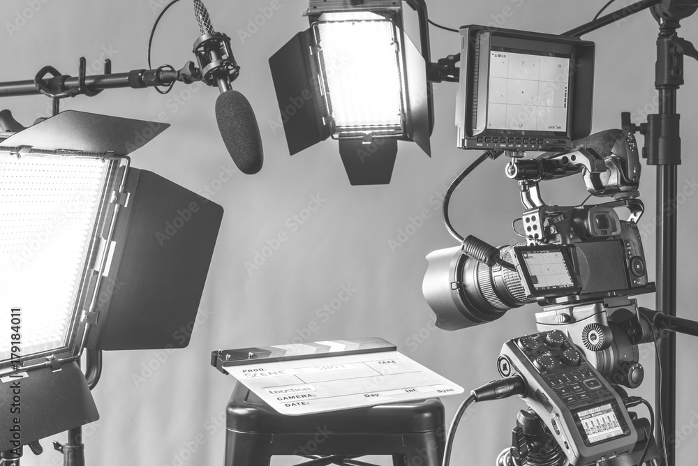 Professional video camera, lights and microphone equipment all set up ...
