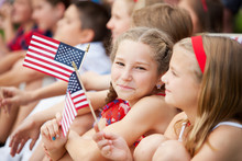 Parade: Cute Girl Holding American Flag