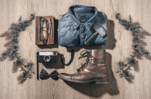 The Objects Of A Hipster Man In Order On A Wood Background.