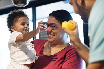 Parents playing with little girl