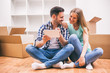 © djoronimo - Young couple is moving to their new home. It's time for packing.