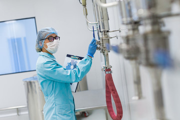 Wall Mural - scientist monitors the readings on the equipment