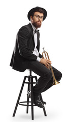 Canvas Print - Trumpet player sitting on a chair and looking at the camera