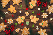 Christmas background with homemade gingerbread cookies and New Year decor on old wooden background. Merry Christmas greeting card