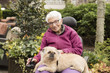 © RachelKolokoffHopper - Independent Elderly Woman Outside in Wheelchair with Dog in Lap