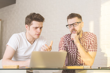 Canvas Print - Handsome guys working on project