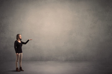 Wall Mural - Woman standing in front of a blank wall