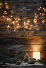 Christmas Decorations And Lights On Wooden Background