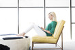 © Kolostock/Blend Images - Caucasian woman sitting in chair using laptop