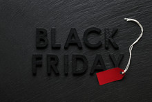 Black Friday Text With Red Sale Tag On Slate Background