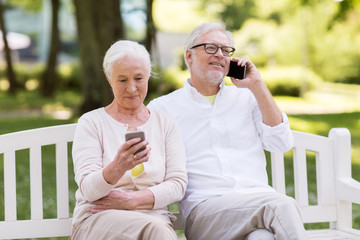 Sticker - happy senior couple with smartphones at park