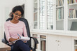 © Strauss/Curtis/Blend Images - Mixed Race woman writing on notepad