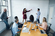 © FS Productions/Blend Images - Business people using whiteboard in meeting