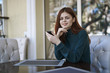 © Dmitry Ageev/Blend Images - Caucasian woman texting on cell phone at restaurant