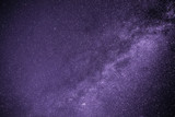 Fototapeta Tęcza - Background of starry purple night sky with the Milky Way