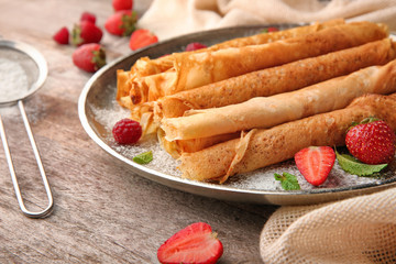 Sticker - Metal plate with delicious thin pancakes on kitchen table