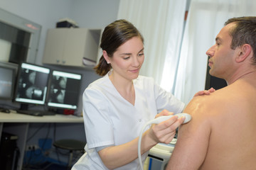 man having a shoulder ultrasound