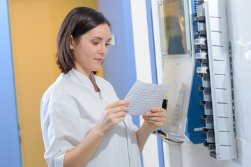 nurse reading a timetable