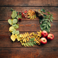 Wall Mural - fall autumn leaves on rustic wooden background