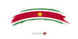 Flag of Suriname in rounded grunge brush stroke.