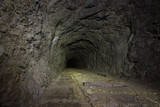 Fototapeta Desenie - Underground abandoned ore mine shaft gallery tunnel 