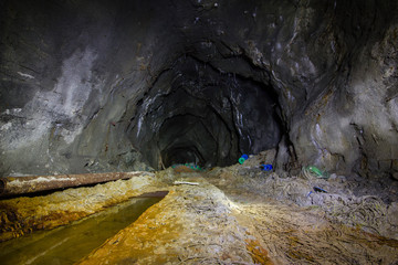 Undeground tunnel gallery in abamdoned mine shaft