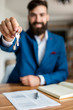 © GutesaMilos - Young estate agent giving keys