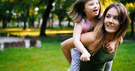 Little girl with special needs enjoy spending time with mother