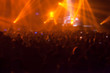 © suwanphoto - blurry image background of many audience concert in big rock concert.