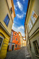 Prague, Czech Republic - October 8, 2017: The Green Grape Hotel Prague at Jansky Vrsek street, Mala Strana, Prague, Czech Republic. Street with old beautiful buildings and bright blue sky