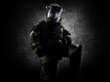 © andy_gin - Military man in a protective sapper suit is kneeling and is preparing to neutralize the bomb.