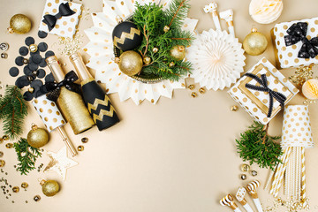 Wall Mural - Christmas decoration background in golden and black colors. Flat lay, top view