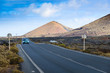 © alexanderkonsta - Volcanic landscape with a road on the island of LanzaroteCanary Islands. Spain