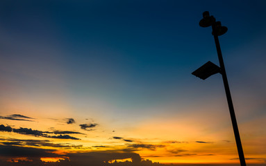 Wall Mural - lamp post silhouette with sunset sky.