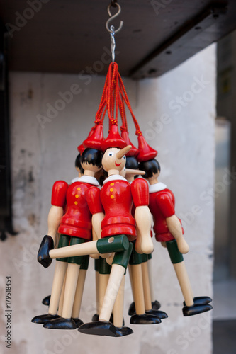Wooden Pinocchio's figurines sold as souvenirs in Gubbio, Umbria, Italy