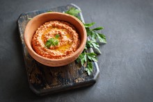 
    Paprika Dip. Traditional Middle Eastern Dip From Roasted Paprika, Nuts, Onion And Garlic With Fresh Parsley. Copy Space 