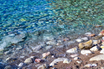 Wall Mural - The sea view. Calm sea and large prilezhnye stones. Transparent water of the Adriatic Sea. Montenegro