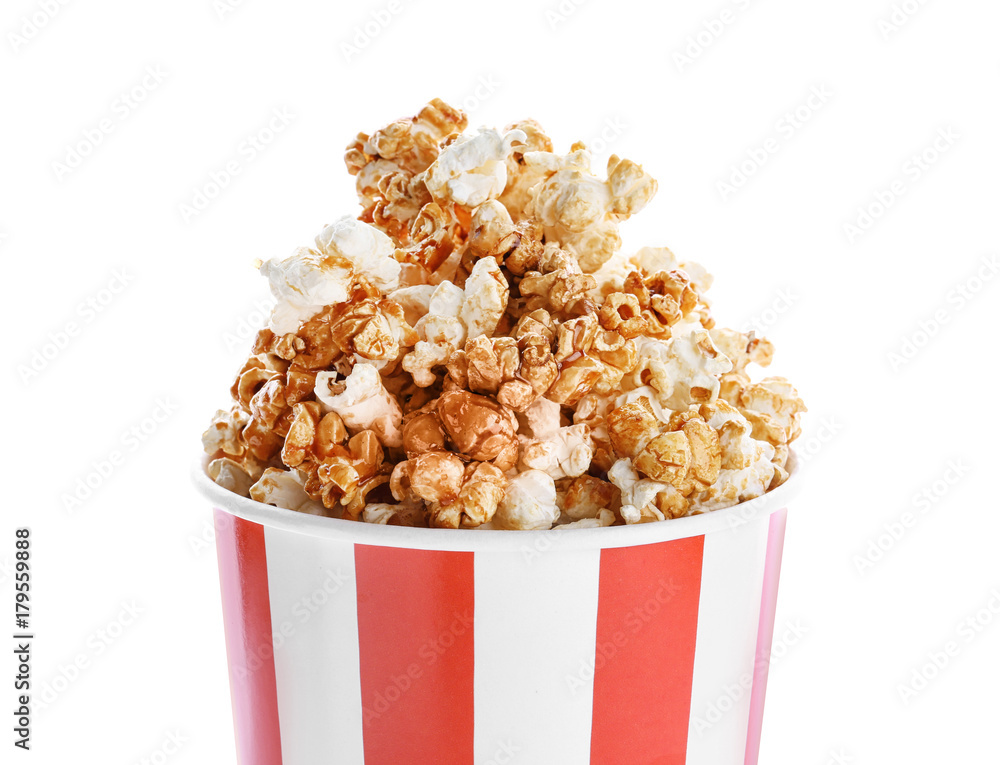 Cup with tasty caramel popcorn on white background