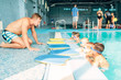 © Nomad_Soul - Instructor talking to children in the pool
