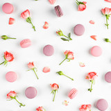 Fototapeta Tulipany - A beautiful pattern made of  macaroons and roses. flat lay,  top view,
