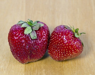 strawberry,  two ripe red berries