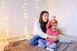 © sisterspro - Communication of older female sister with youngest girl who spen