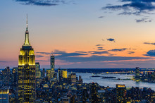City Skyline And Empire State Building At Night In NYC, USA