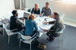 © Jacob Lund - Group of business people in meeting at office