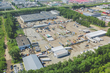 Top View Of Industrial Buildings With Parking For Trucks